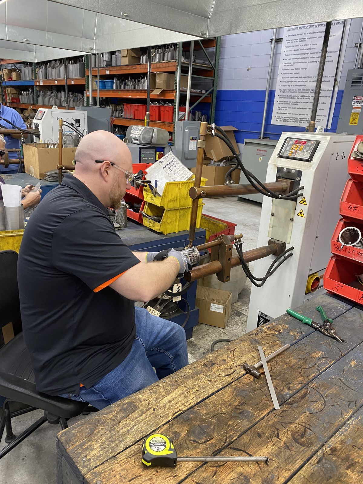 Rob Warnell working hands-on at a shop bench