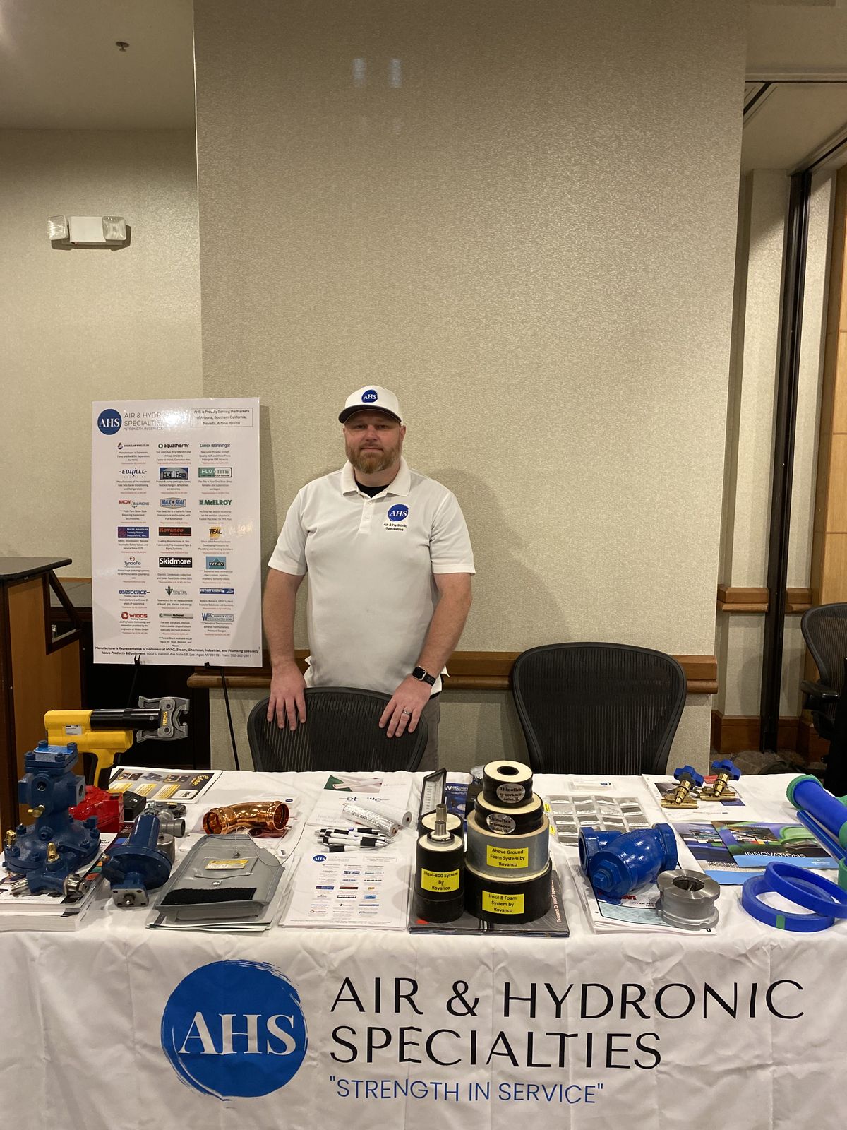 AHS rep behind the AHS table with valve and fitting samples