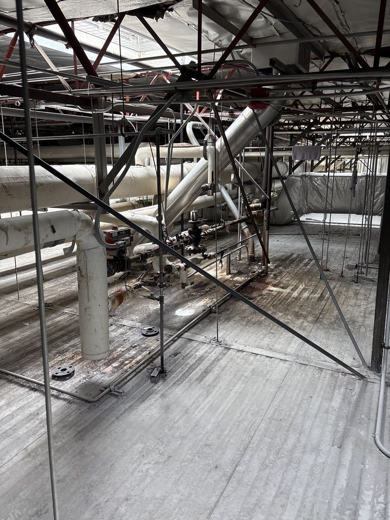 Overhead interstitial space with insulated piping and valves